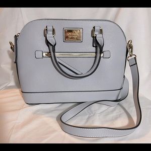 Baby blue handbag with cross body strap.
